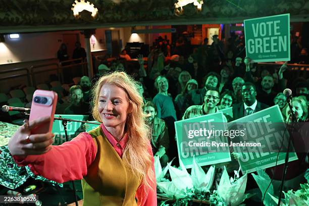 Green Party candidate and winner Hannah Spencer celebrates at an election rally with supporters at The Niamos Radical Arts Centre on February 26,...