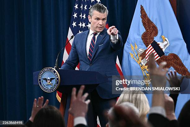 Defense Secretary Pete Hegseth takes questions during a press conference on US military action in Iran, at the Pentagon in Washington, DC, on March...