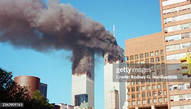 View of smoke and flames from the World Trade Center Towers in the wake of the September 11 terrorist attacks, New York, New York, September 11, 2001.