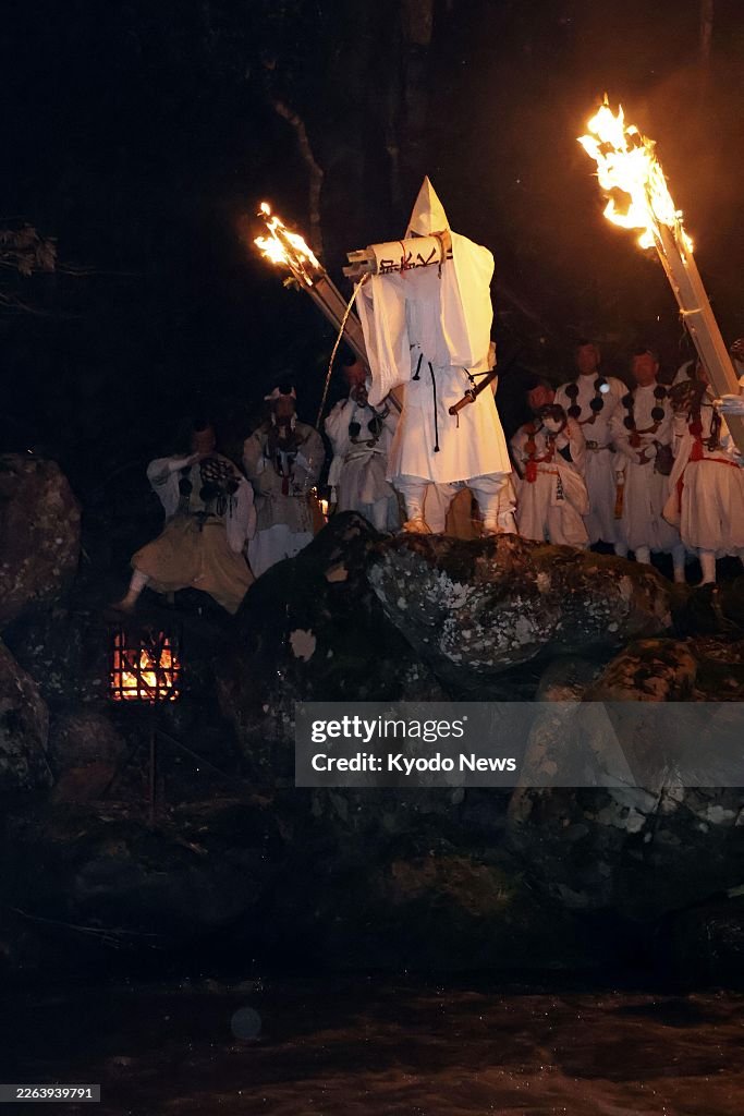 Ritual to pour holy water into river in Japan