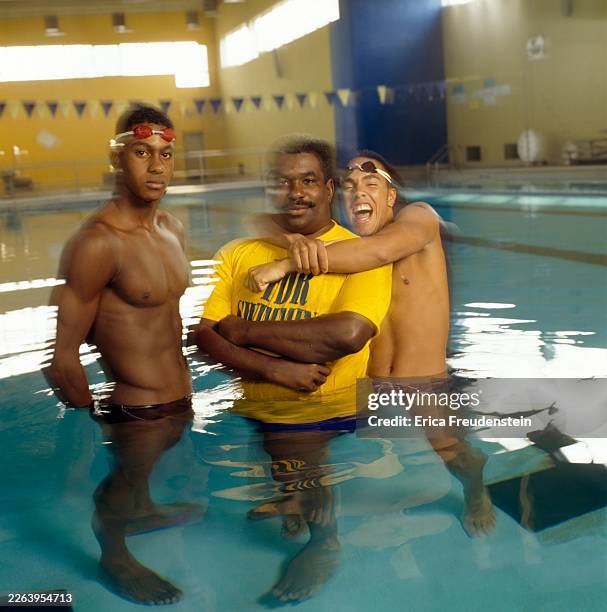 Olympic swimmer Michael Norment, American swim coach Jim Ellis and an unidentified swimmer pose for a portrait in a swimming pool in Philadelphia,...