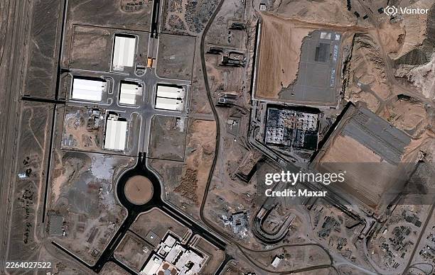 Vantor satellite image shows the Natanz nuclear facility under construction in 2002 showing buildings and infrastructure development. Please use:...