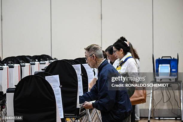 People vote on Election Day at a polling location at West Gray Metropolitan Multi-Service Center in Houston, on March 3, 2026. Americans cast the...