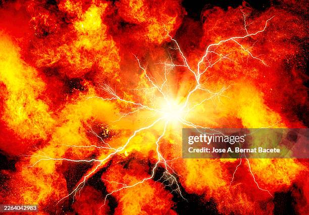 explosion of moving electrical energy with lightning, fire and smoke on a black background. - explosive stock pictures, royalty-free photos & images
