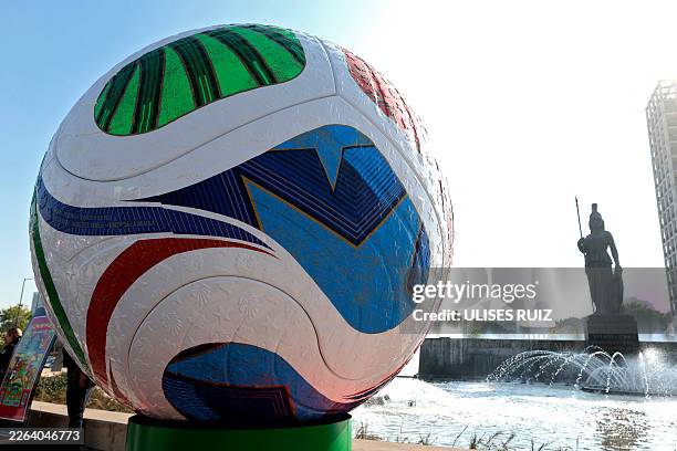 A giant model of the football called "Trionda" is seen at the roundabout where the "Minerva" statue stands, as part of the announcements marking 100...