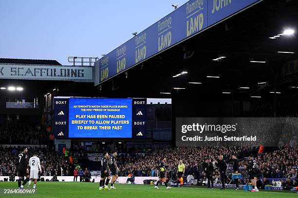 General view as the screen in the ground announces a break in play to allow players to break their fast for Ramadan during the Premier League match...