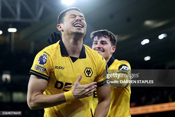 Wolverhampton Wanderers' Brazilian defender Andre celebrates scoring the team's second goal during the English Premier League football match between...
