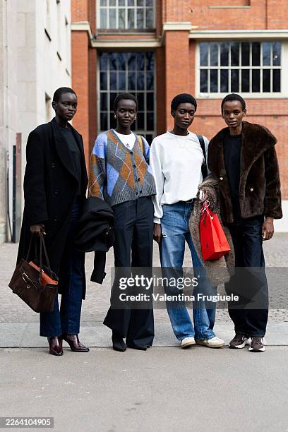 Model wears on the left a black long coat, a black sweater, blue jeans a brown leather bag and brown leather boots, in the middle a model wears a...