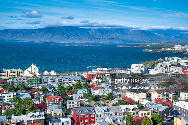 panoramic reykjavik iceland captured from above during golden hour with vibrant summer light - reykjavik stock pictures, royalty-free photos & images