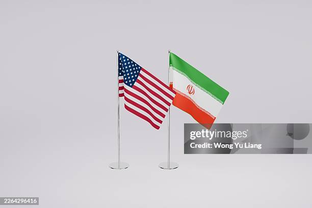 iran and usa flag on table - iran bildbanksfoton och bilder