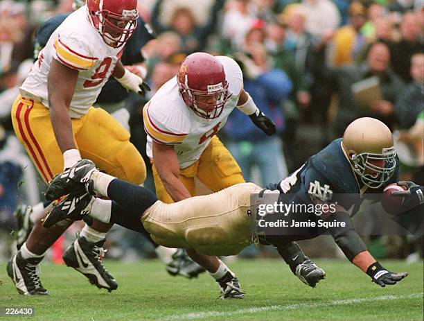 NOTRE DAME FULLBACK MARC EDWARDS, #44, DIVES OVER THE GOALINE FOR THE FIGHTING IRISH''S FIRST TOUCHDOWN OF THE GAME DURING THE FIRST QUARTER OF NOTRE...