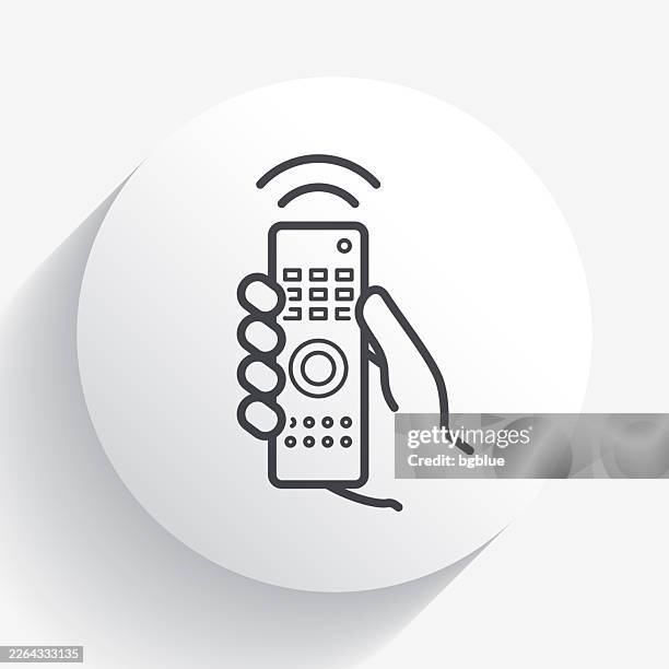 hand with remote control. icon on circle button with long shadow - changing channels stock illustrations
