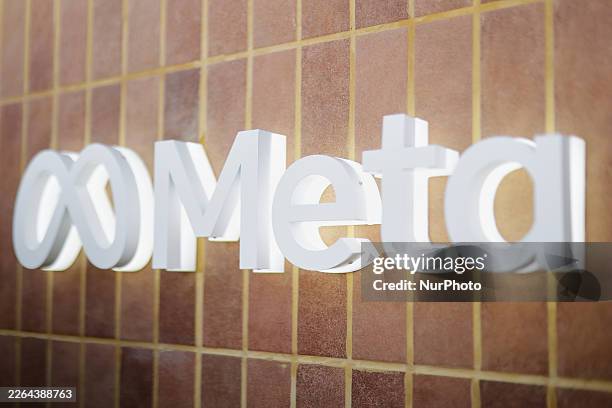The official Meta corporate logo features prominently at MWC 2026, showcasing its iconic infinity symbol rendered in a vibrant blue-to-deep-blue...