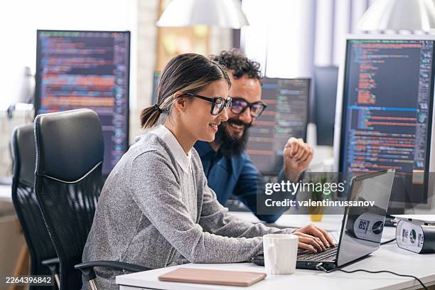 software engineers collaborating on new program coding development - hackathon stock pictures, royalty-free photos & images