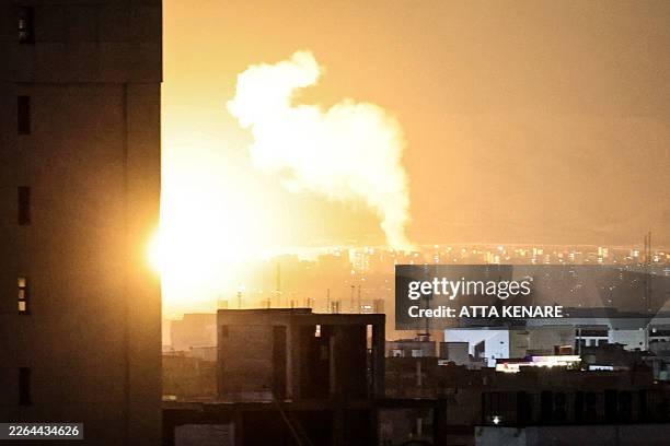 Smoke and fire rise from the site of airstrikes in a central area of the Iranian capital Tehran on March 6, 2026. Fresh strikes rocked Iran and...