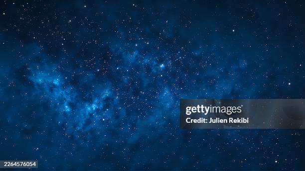 Cosmic blue sky filled with stars in nebulous space Panorama