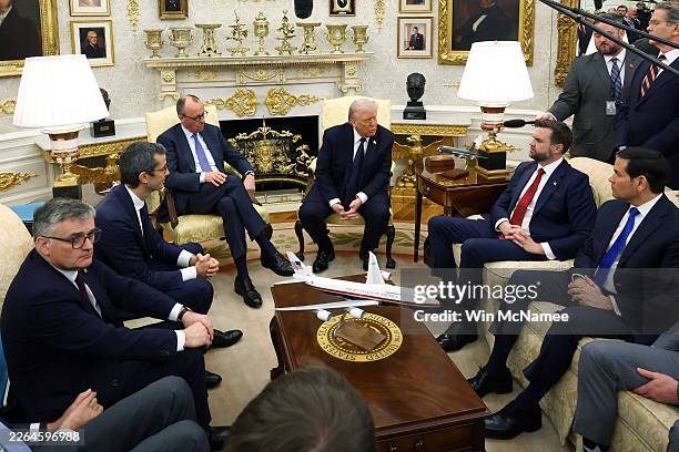 President Donald Trump and German Chancellor Friedrich Merz attend a bilateral meeting in the Oval Office of the White House on March 03, 2026 in...