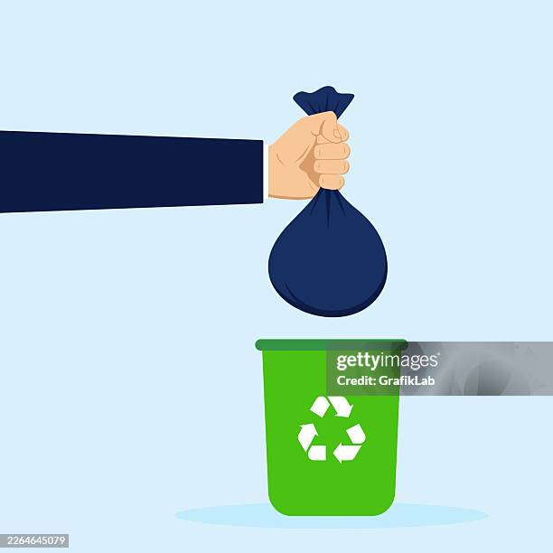 hand throwing a bag into a recycling bin and environmental responsibility - garbage can stock illustrations