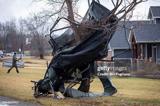 Debris is wrapped around a tree following a tornado that hit several cities in rural southwest Michigan on March 7, 2026 in Union City, Michigan....