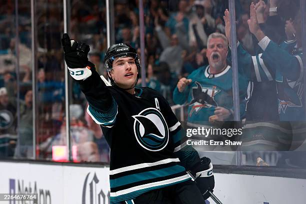 Macklin Celebrini of the San Jose Sharks reacts after he scored a goal against the Montreal Canadiens during the second period at SAP Center on March...