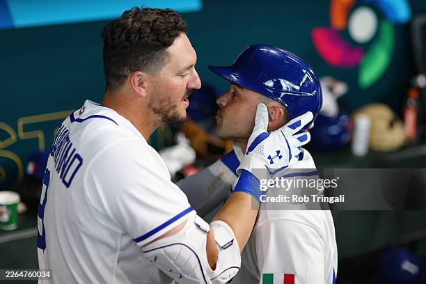 Vinnie Pasquantino and Dante Nori of Team Italy celebrate in the dugout after Nori hit a home run in the eighth inning during the 2026 World Baseball...