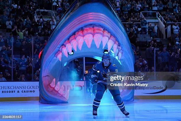 Macklin Celebrini of the San Jose Sharks takes the ice through the Shark Head before the game against the New York Islanders at SAP Center on March...