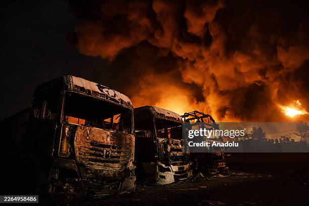 Fire breaks out at the Shahran oil depot after US and Israeli attacks, leaving numerous fuel tankers and vehicles in the area unusable in Tehran,...