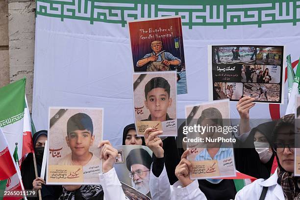 Iranian women hold portraits of children who are killed in the U.S.-Israeli attacks and an anti-U.S. President Donald Trump participate in a protest...