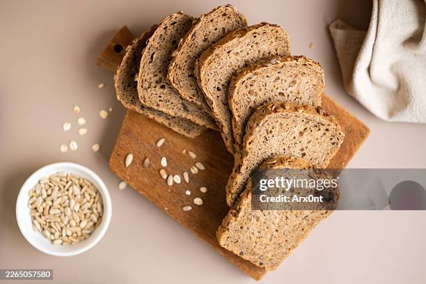 whole grain bread - whole wheat stock pictures, royalty-free photos & images