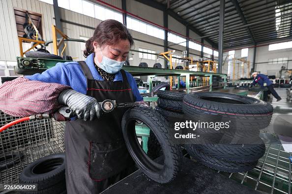 Purchasing Process Visual Workers process tyre orders destined for export at a vehicle company ...