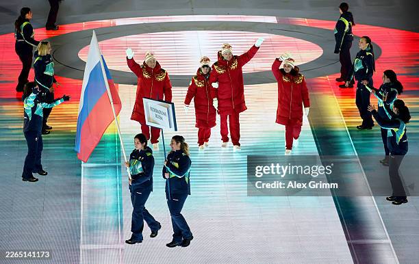 Volunteer Flagbearers of Team Russia walk through the stadium with athletes of Team Russia during the Milano Cortina 2026 Winter Paralympic Games...