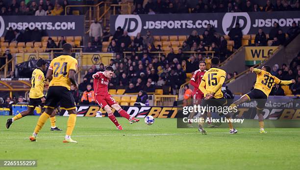Andrew Robertson of Liverpool scores his team's first goal during the Emirates FA Cup Fifth Round match between Wolverhampton Wanderers and Liverpool...