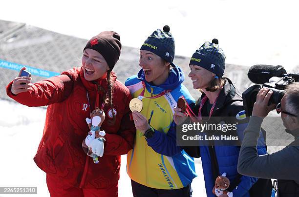 Gold medalist Oleksandra Kononova of Team Ukraine, Silver medalist Natalie Wilkie of Team Canada and Bronze medalist Liudmyla Liashenko of Team...