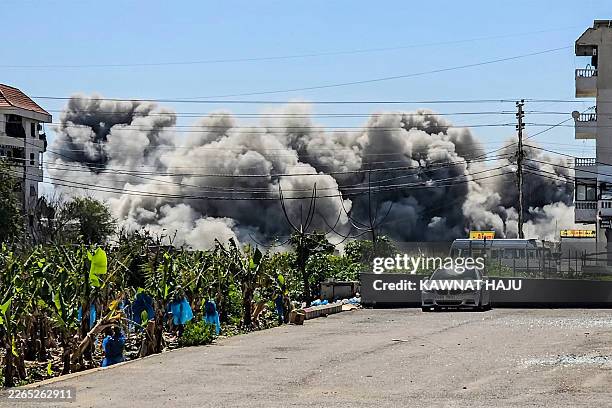 Smoke rises from the site of an Israeli airstrike on the village of Abbasiyeh in southern Lebanon on March 10, 2026. Lebanon was drawn into the...