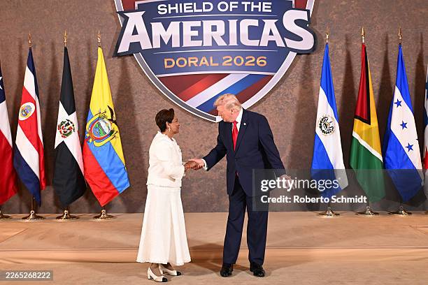 President Donald Trump greets Kamla Persad-Bissessar, SC, MP, Prime Minister of the Republic of Trinidad and Tobago, as he hosts “The Shield of the...