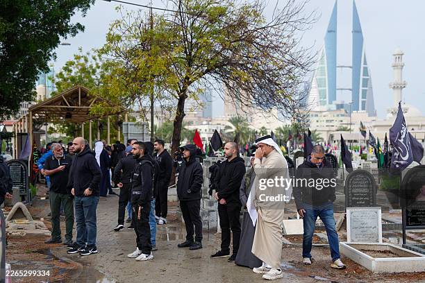 People attend the funeral of a person killed during a drone attack on a high-rise apartment building in Bahrain's capital Manama on March 10, 2026....