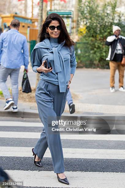 Barbara Martelo wears blue turtleneck, pants outside Hermes during Day Six of Paris Fashion Week - Womenswear Fall/Winter 2026/2027 on March 07, 2026...