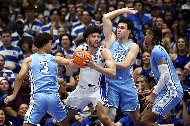 Cameron Boozer of the Duke Blue Devils posts up against the North Carolina Tar Heels during the first half of the game at Cameron Indoor Stadium on...