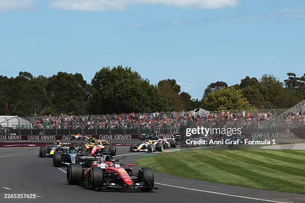 Charles Leclerc of Monaco driving the Scuderia Ferrari SF-26 leads George Russell of Great Britain driving the Mercedes AMG Petronas F1 Team W17 at...