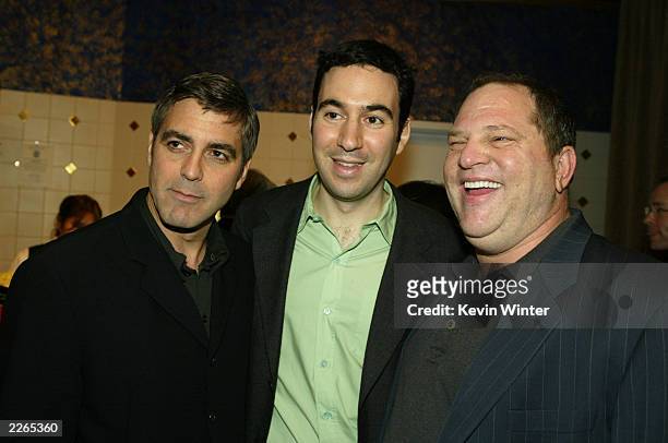 George Clooney, ex. Prod. Jon Gordon and ex. Prod. Harvey Weinstein at the premiere of "Confessions of a Dangerous Mind" at the Bruin Theatre and...
