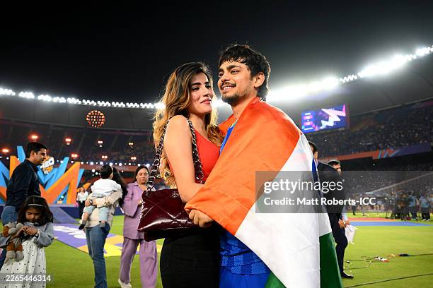 Ishan Kishan of India looks on alongside Partner Aditi Hundia following the ICC Men's T20 World Cup India & Sri Lanka 2026 Final between India and...