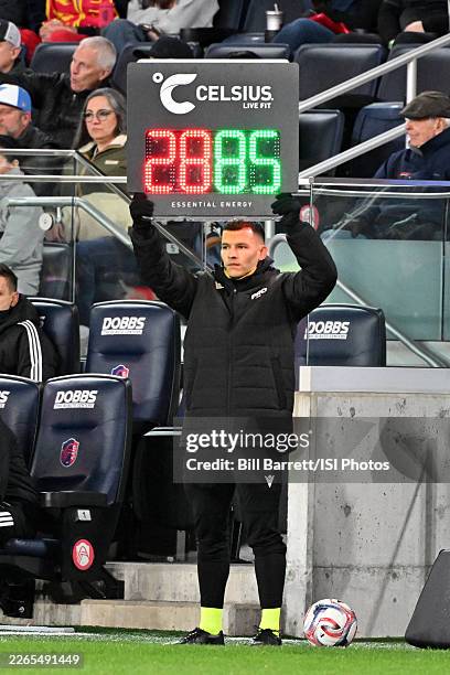 4th Official Lorenzo Hernandez holds up a board indicating a substitution during the first half of a MLS game between St. Louis City SC and Seattle...
