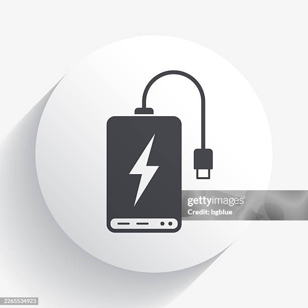 power bank. icon on circle button with long shadow - external hard disk drive stock illustrations