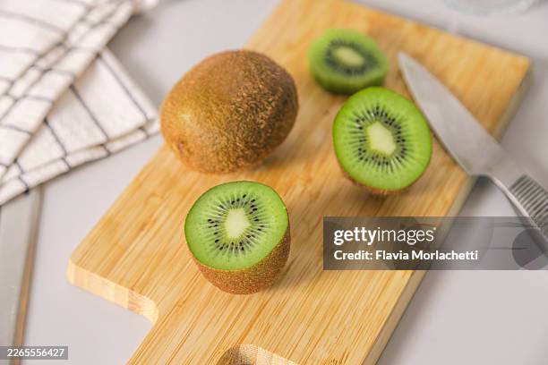 halved kiwi for breakfast - kiwi fruit stock pictures, royalty-free photos & images