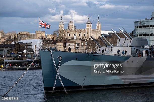 Belfast on the River Thames looking towards the Tower of London on 28th February 2026 in London, United Kingdom. HMS Belfast is a museum ship,...