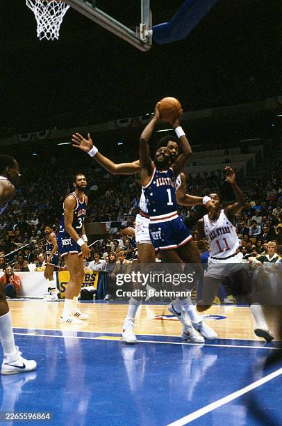 Gus Williams taking a shot during an NBA All-Star game at Brendan Byrne Arena in East Rutherford, New Jersey, January 31st 1982. Isiah Thomas is at...