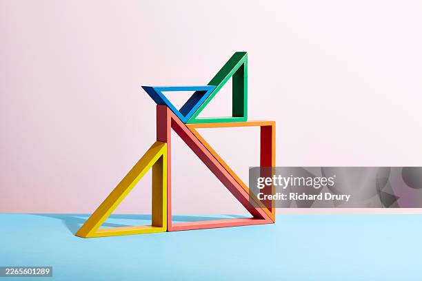 stack of triangles - solid structure stock pictures, royalty-free photos & images