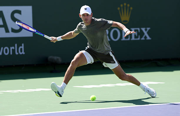 Alex de Minaur of Australia plays a forehand against Cameron Norrie of Great Britain in their third round match of the BNP Paribas Open at Indian...