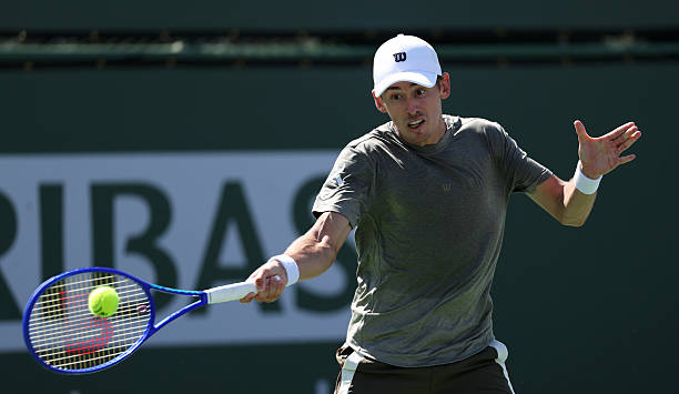 Alex de Minaur of Australia plays a forehand against Cameron Norrie of Great Britain in their third round match of the BNP Paribas Open at Indian...