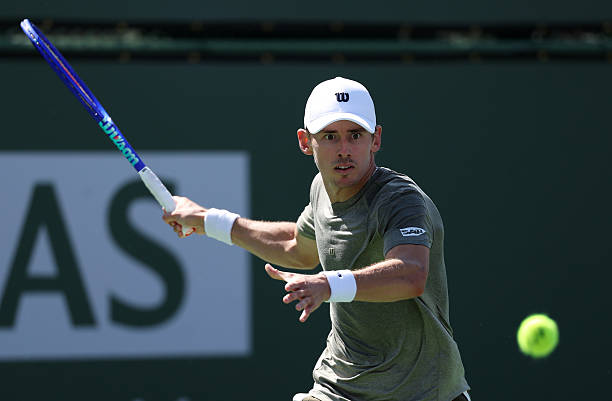 Alex de Minaur of Australia plays a forehand against Cameron Norrie of Great Britain in their third round match of the BNP Paribas Open at Indian...